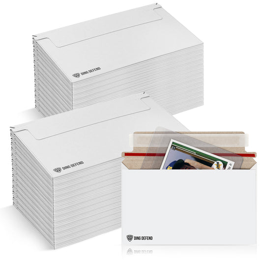Stacks of Ding Defend card shipping envelopes with a filled envelope showing trading cards inside, designed for 7 x 4.35 inch self-adhesive mailers