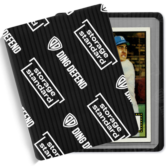 Black Ding Defend 3.5 x 4.5 inch trading card protector sleeve partially open, showing a card inside for secure shipping protection