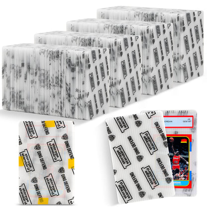 Bulk pack of Ding Defend 4 x 6 trading card shipping protectors stacked together with examples showing a graded card inside a semi-transparent protector