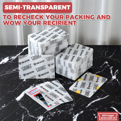 Product photo showing semi-transparent Ding Defend 4 x 6 trading card shipping protectors stacked with visible cards to demonstrate contents inside